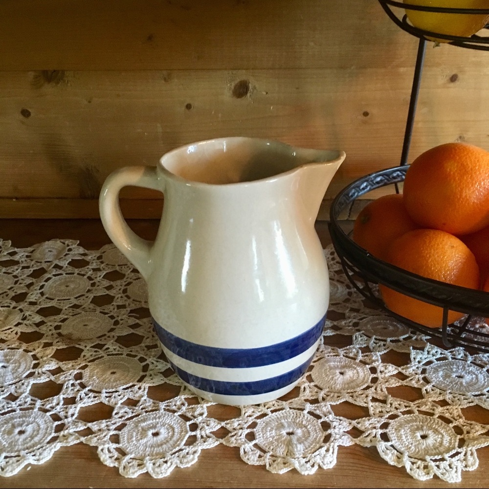 Ceramic pitcher with blue stripes
